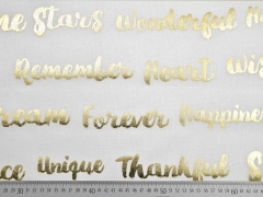 Dekostoff "Metallic Words", gold creme