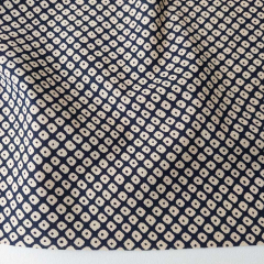 Baumwollstoff Kringel-Muster dunkelblau-beige