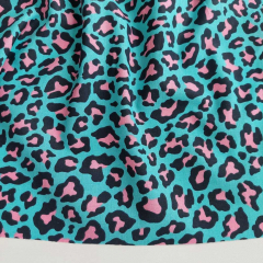 Baumwollstoff Leopardenmuster mint rosablauschwarz Meterware